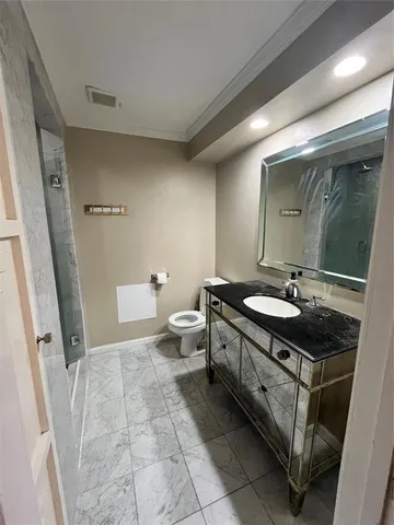 a bathroom with a shower and a sink