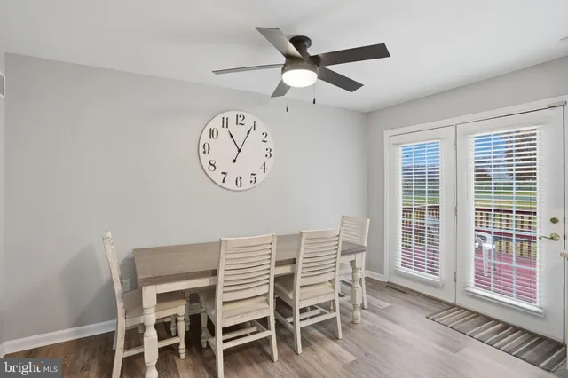 a view of a dining area with furniture and a large window