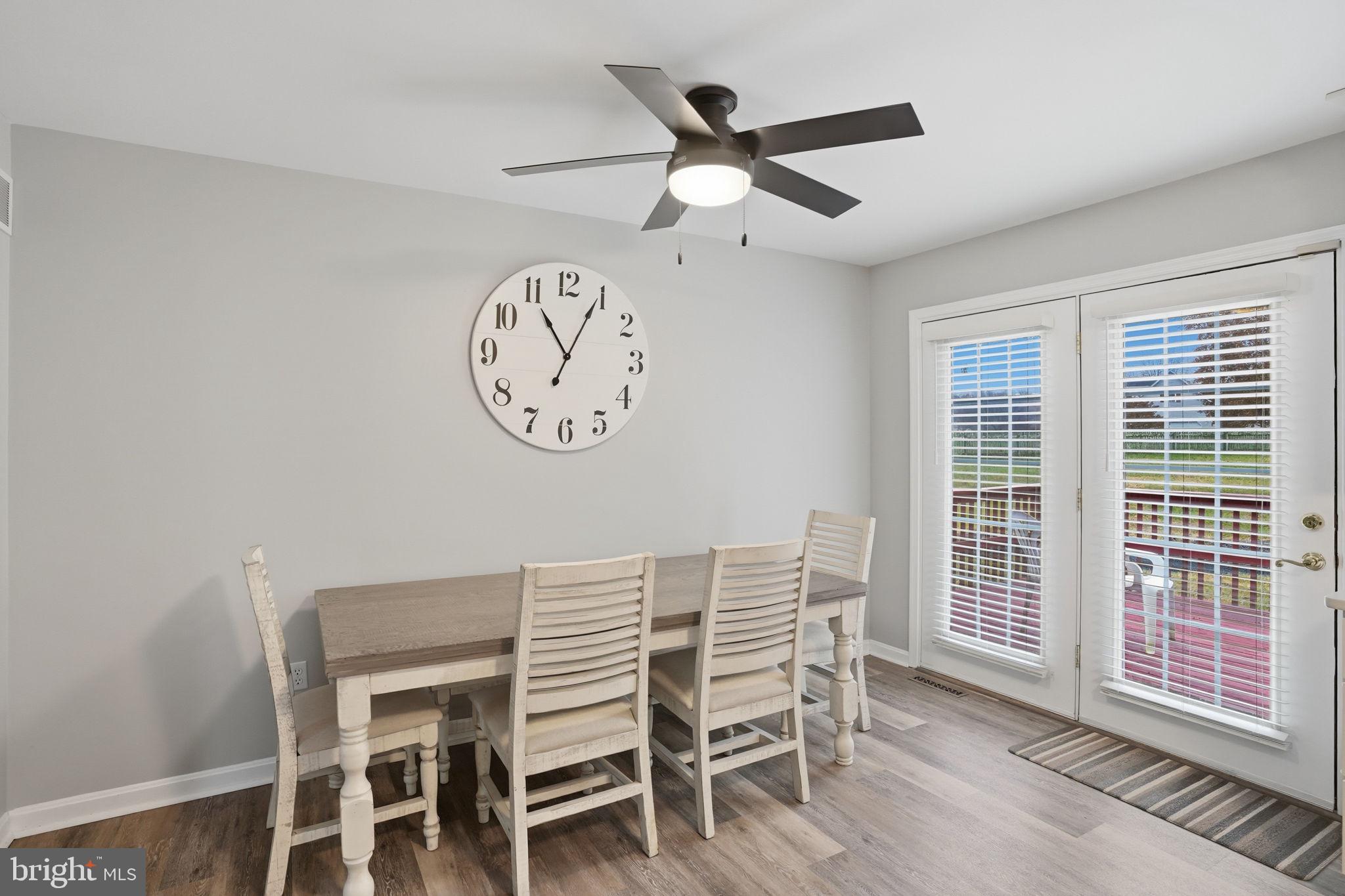 251 Misty Ridge Drive Magnolia, DE 19962 - Photo 14 of 33 a view of a dining area with furniture and a large window