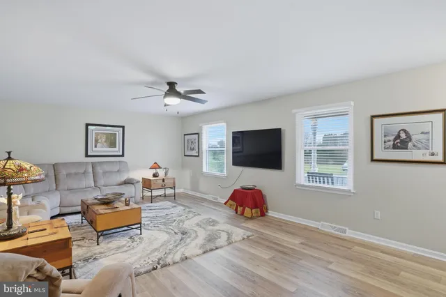 a bedroom with furniture and a flat screen tv