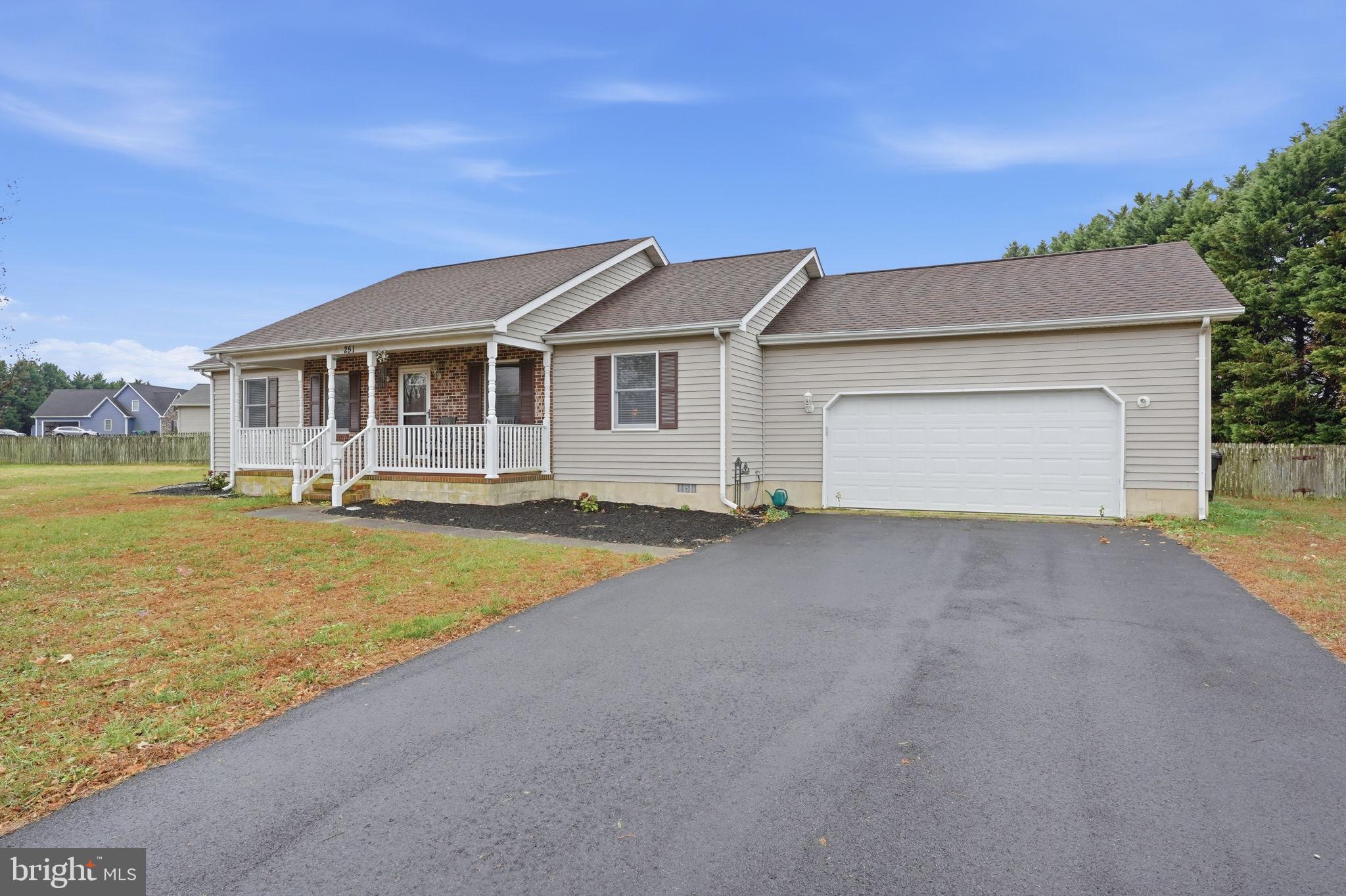 251 Misty Ridge Drive Magnolia, DE 19962 - Photo 31 of 33 a front view of a house with a yard and lake view