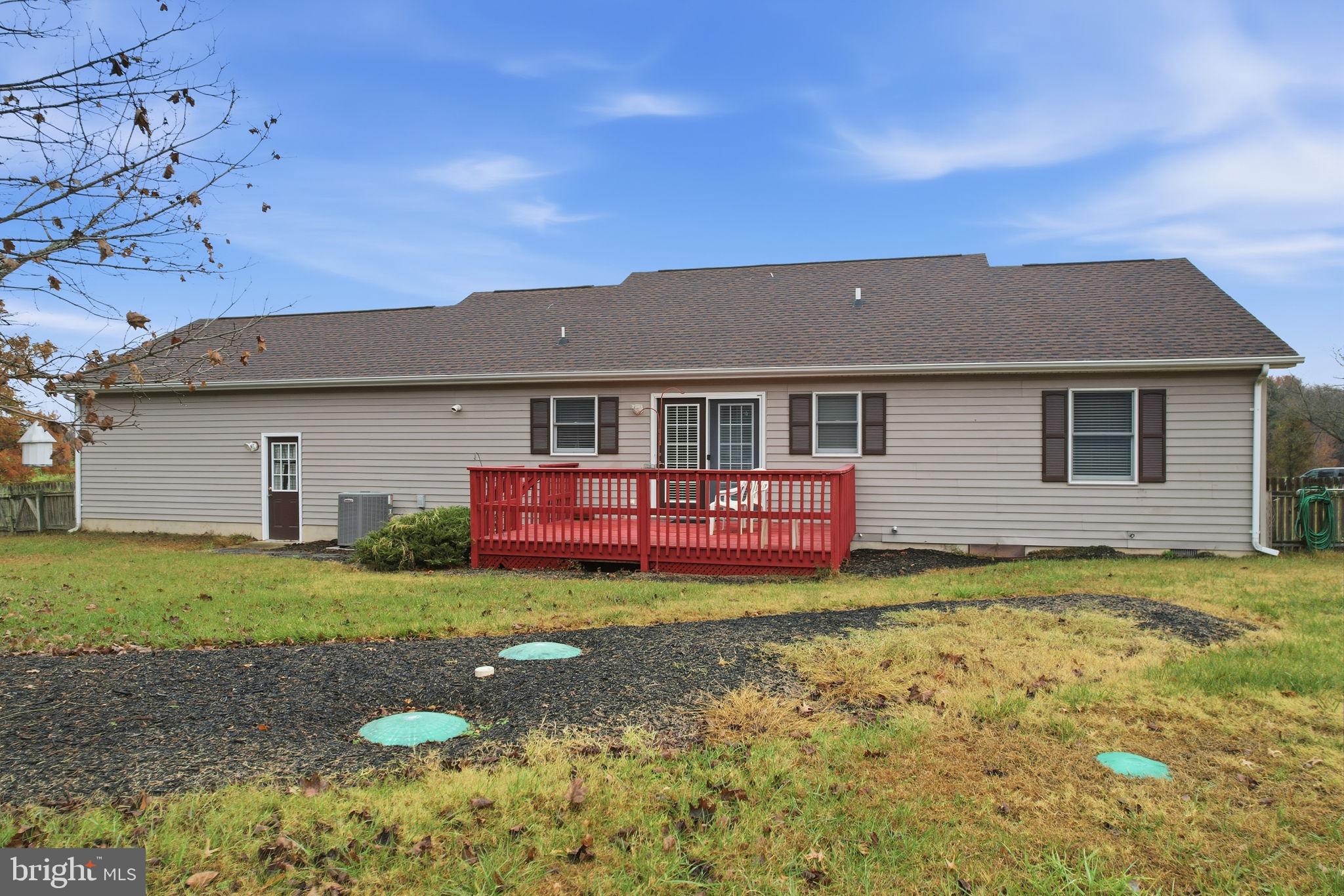 251 Misty Ridge Drive Magnolia, DE 19962 - Photo 33 of 33 a front view of a house with a garden and yard