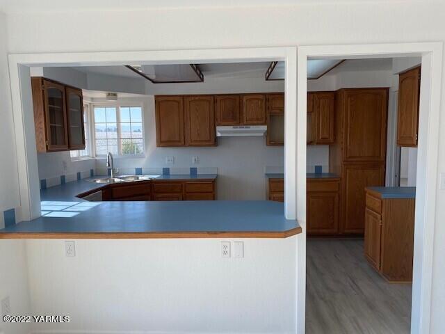 2807 Nelson Road Yakima, WA 98903 - Photo 9 of 11 a kitchen with kitchen island a counter top a sink and a refrigerator