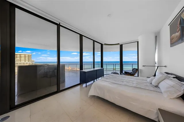 a bedroom with a bed and a chair