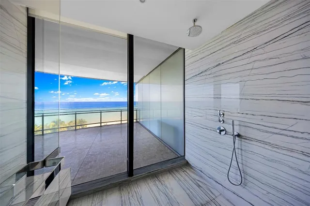 a view of an empty room with glass door