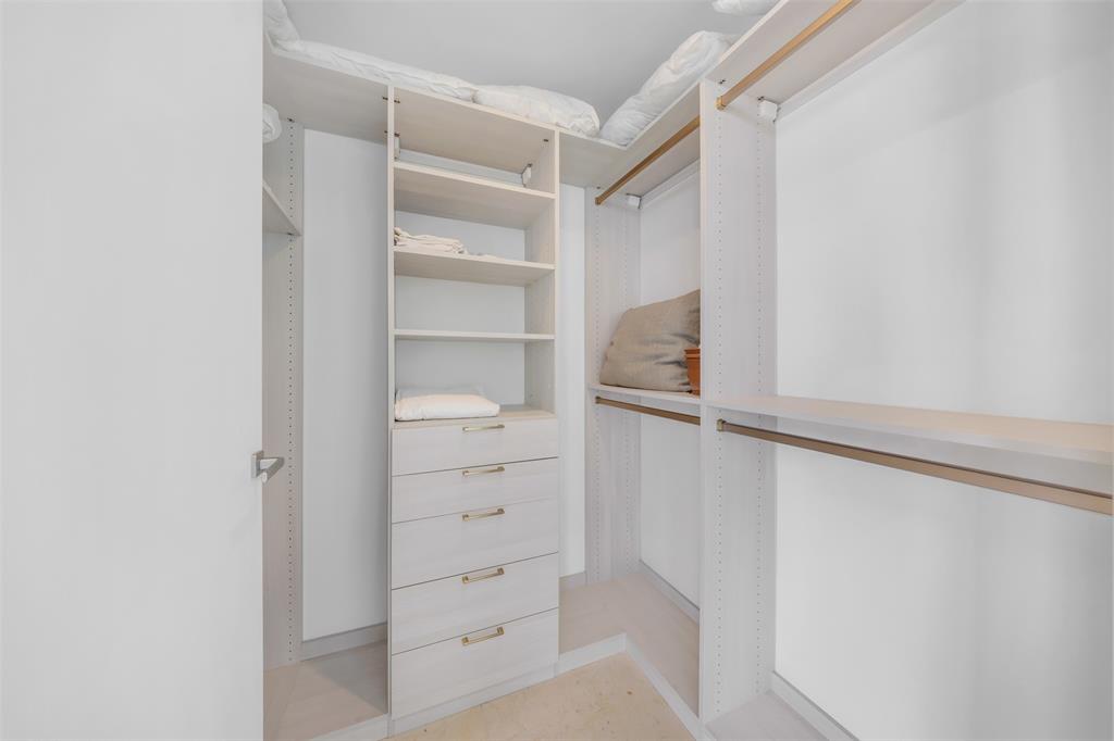 8701 Collins Avenue, Unit 701 Surfside, FL 33154 - Photo 30 of 91 a view of walk in closet with empty racks