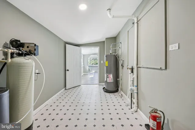 a view of a house with yard and a tree