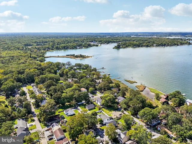 an aerial view of houses with outdoor space