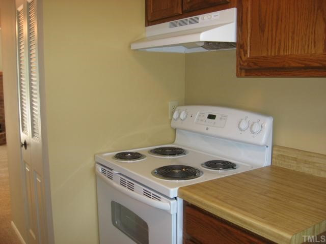 7721 Kingsberry Court Raleigh, NC 27615 - Photo 11 of 11 New electric range in kitchen
