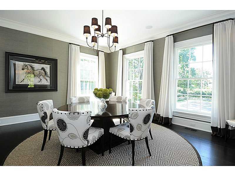 581 Sasco Hill Road Fairfield, CT 06824 - Photo 11 of 25 a dining room with furniture a chandelier and wooden floor