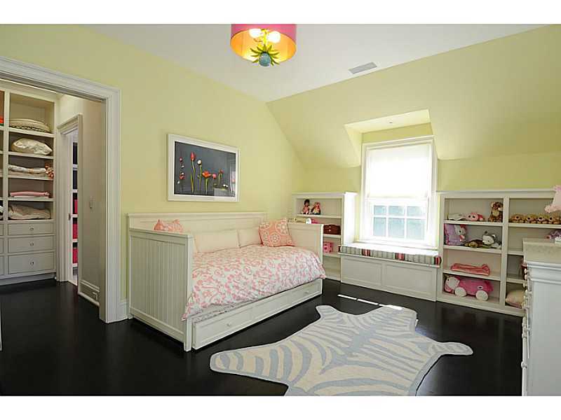 581 Sasco Hill Road Fairfield, CT 06824 - Photo 18 of 25 a bedroom with a bed and a bookshelf