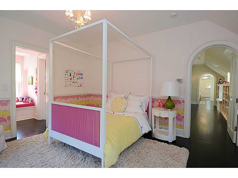 581 Sasco Hill Road Fairfield, CT 06824 - Photo 19 of 25 a bedroom with a bed and wooden floor