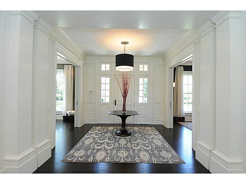 581 Sasco Hill Road Fairfield, CT 06824 - Photo 3 of 25 a living room with furniture and a chandelier
