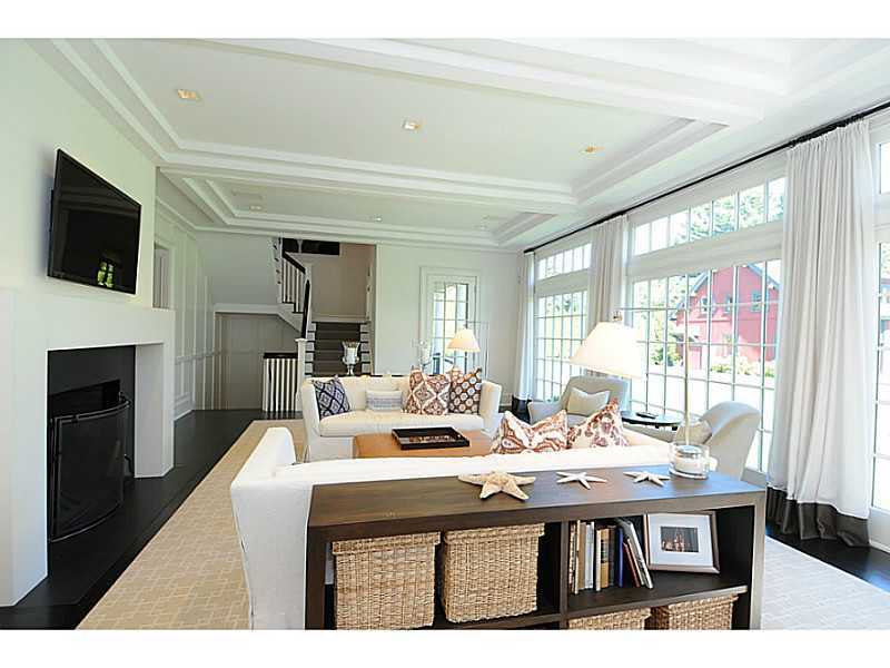 581 Sasco Hill Road Fairfield, CT 06824 - Photo 4 of 25 a living room with fireplace furniture and a flat screen tv