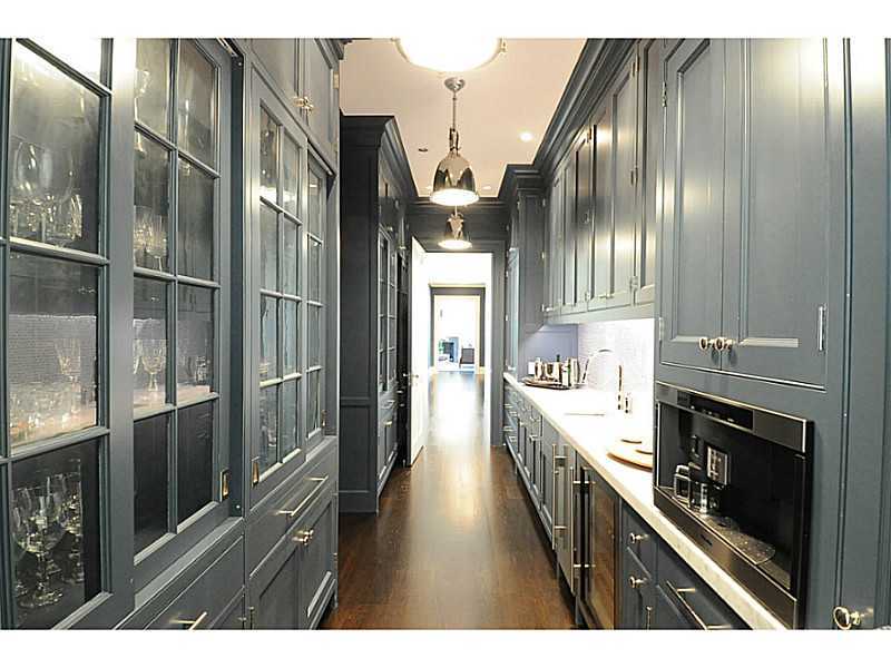 581 Sasco Hill Road Fairfield, CT 06824 - Photo 8 of 25 a open kitchen with stainless steel appliances kitchen island granite countertop a refrigerator a stove and a sink with wooden floor