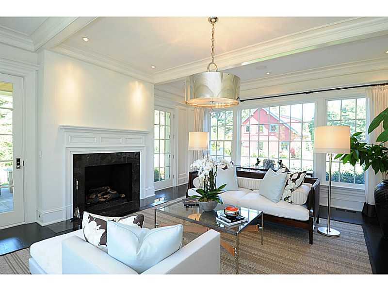581 Sasco Hill Road Fairfield, CT 06824 - Photo 9 of 25 a living room with furniture and a fireplace