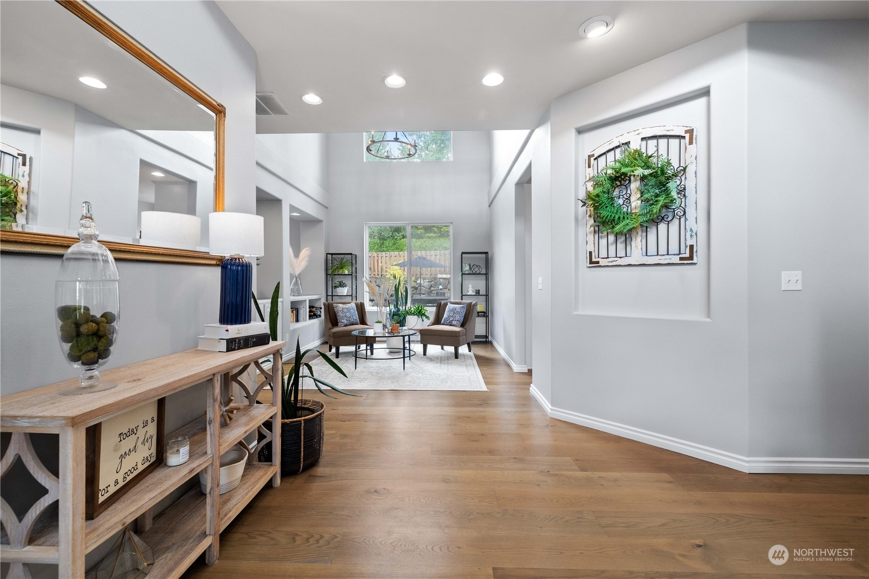 27648 Maple Ridge Way Southeast Maple Valley, WA 98038 - Photo 2 of 40 a view of an entryway with wooden floor and windows