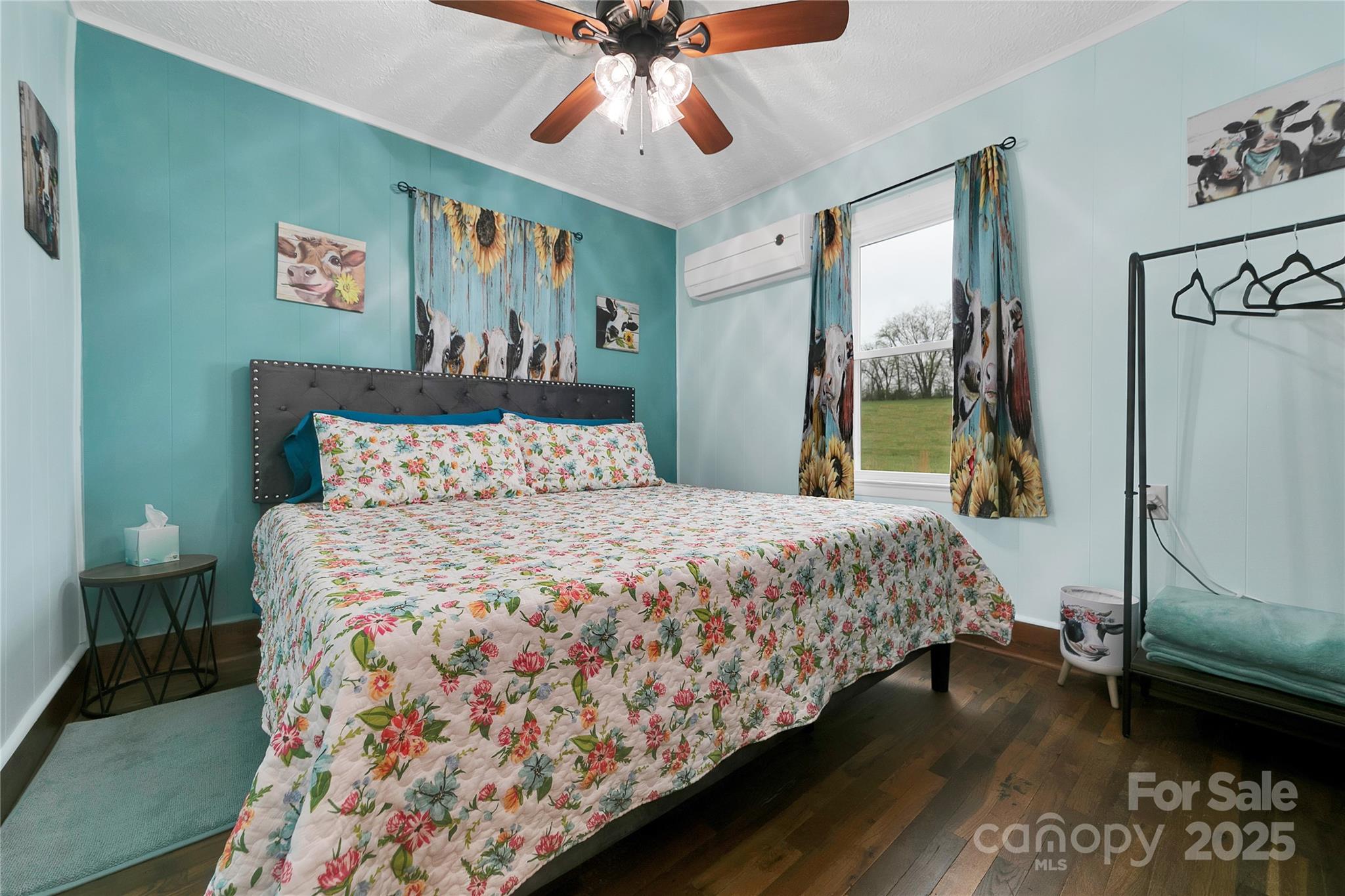 626 Fairview Loop Hot Springs, NC 28743 - Photo 25 of 44 a bedroom with a bed and a chandelier