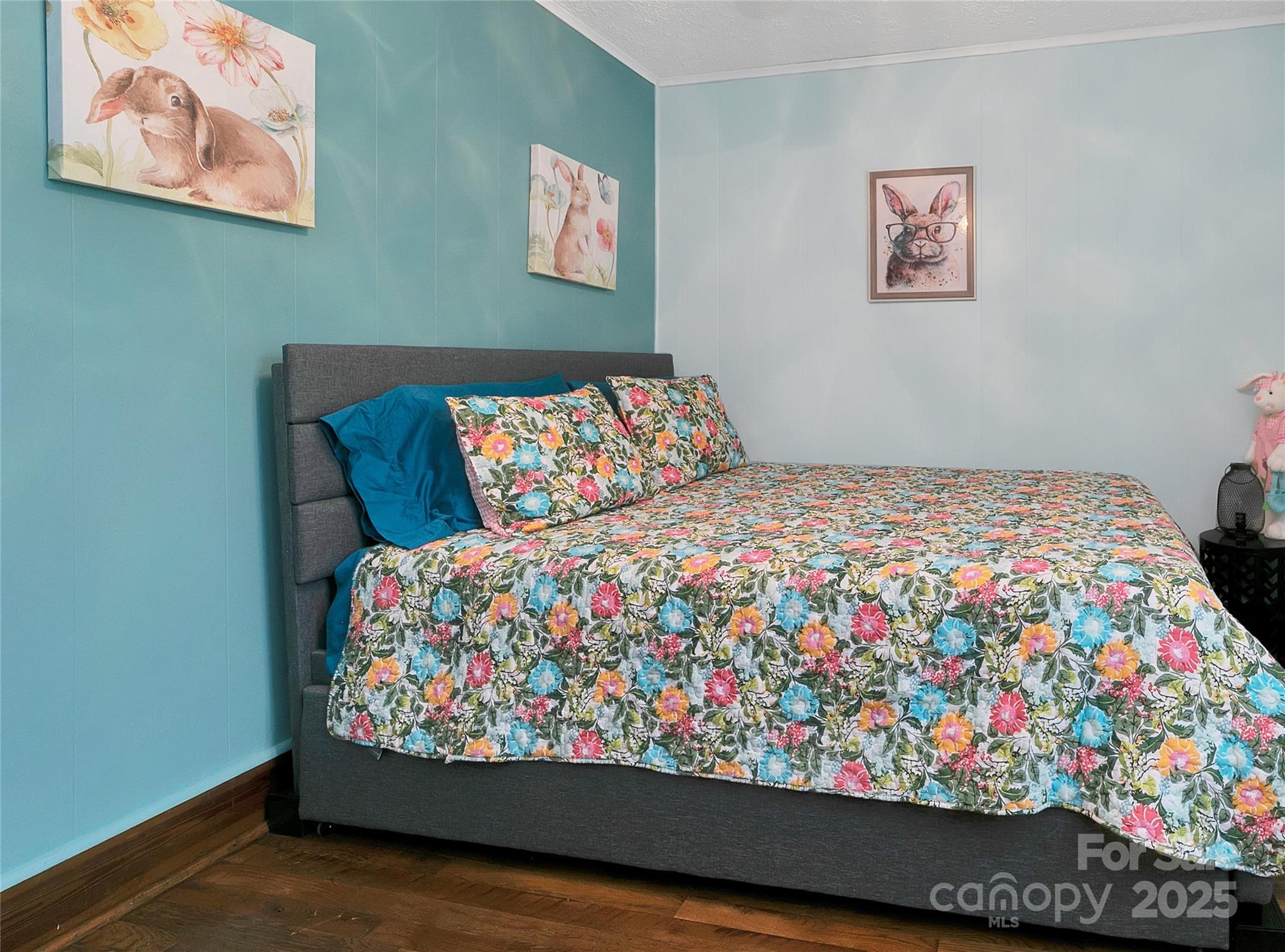 626 Fairview Loop Hot Springs, NC 28743 - Photo 30 of 44 a bed sitting in a bedroom next to a cabinet with a rug