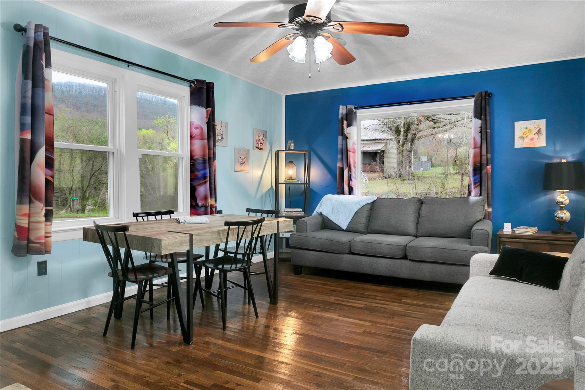 626 Fairview Loop Hot Springs, NC 28743 - Photo 6 of 44 a view of a dining room with furniture window and wooden floor