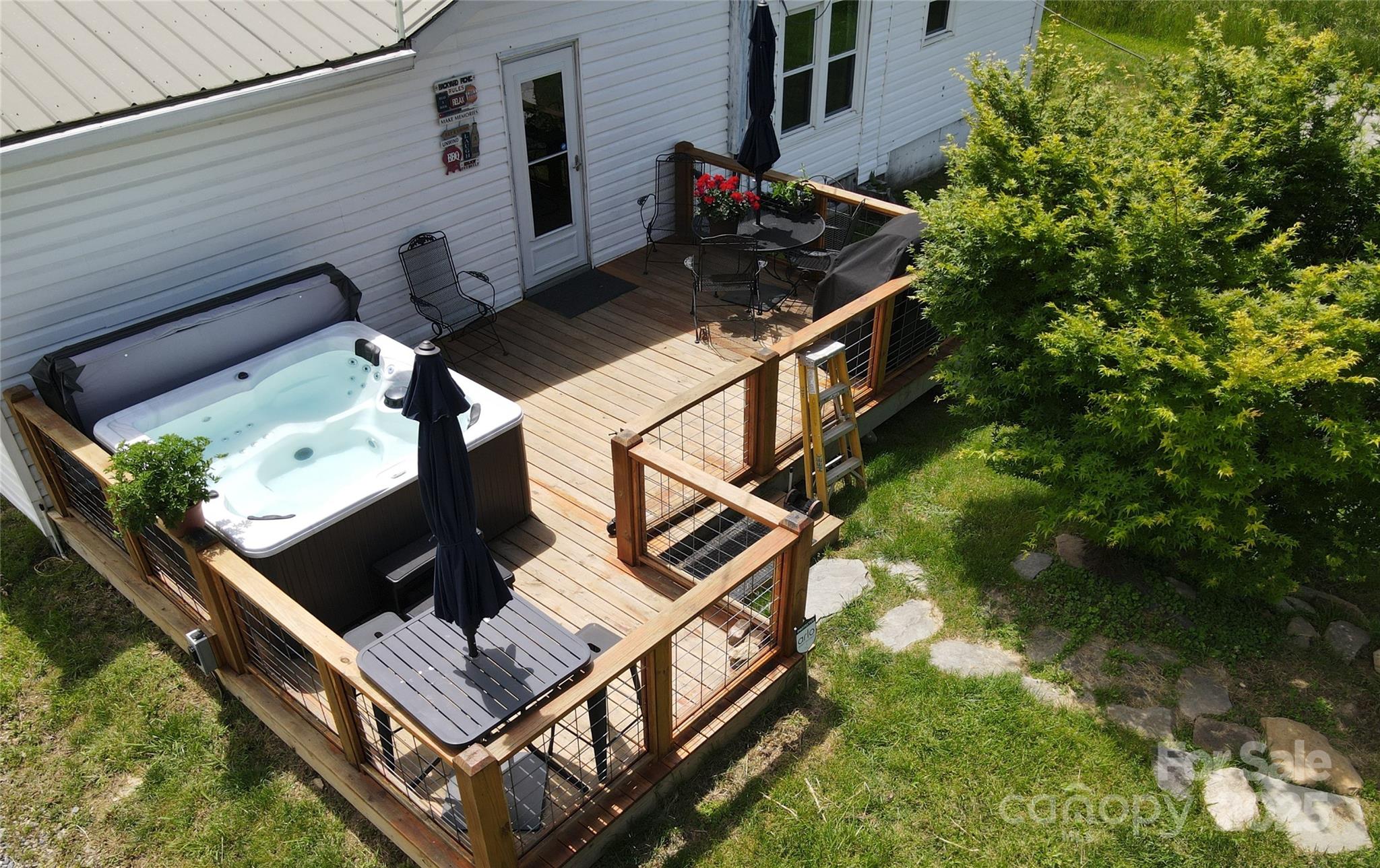 626 Fairview Loop Hot Springs, NC 28743 - Photo 7 of 44 a backyard of a house with table and chairs