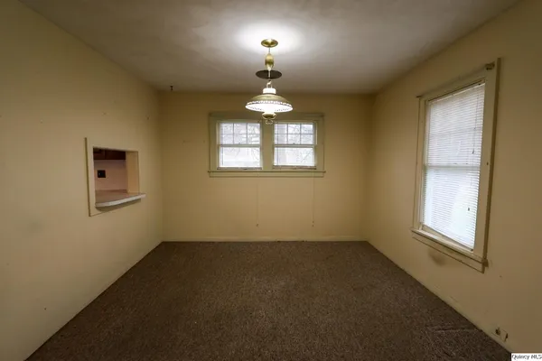 a view of a hallway with windows
