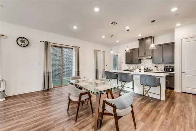 a kitchen with a sink a counter space and stainless steel appliances