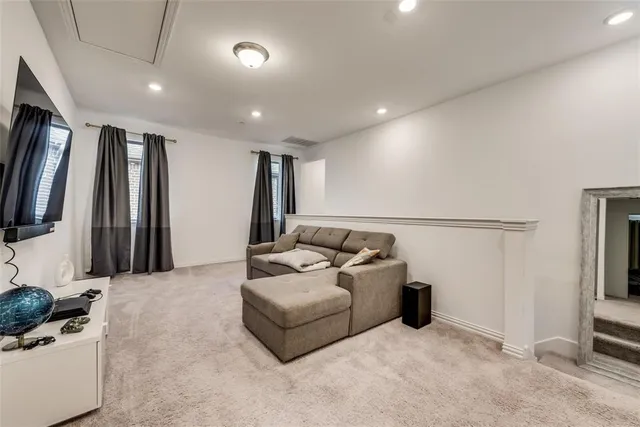 a kitchen with a table chairs refrigerator and cabinets