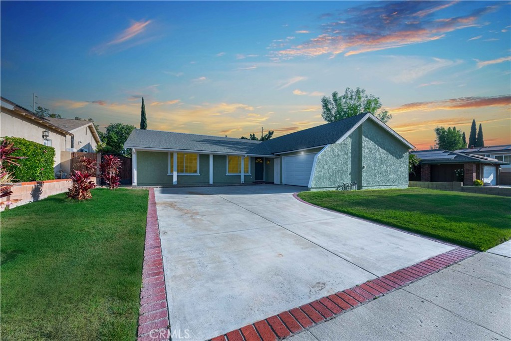 a view of house that has a yard