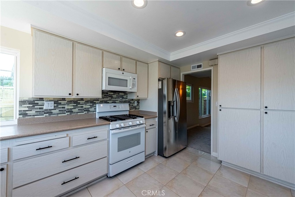 2232 Hawk Street Simi Valley, CA 93065 - Photo 14 of 39 a kitchen with stainless steel appliances granite countertop a refrigerator and a stove top oven