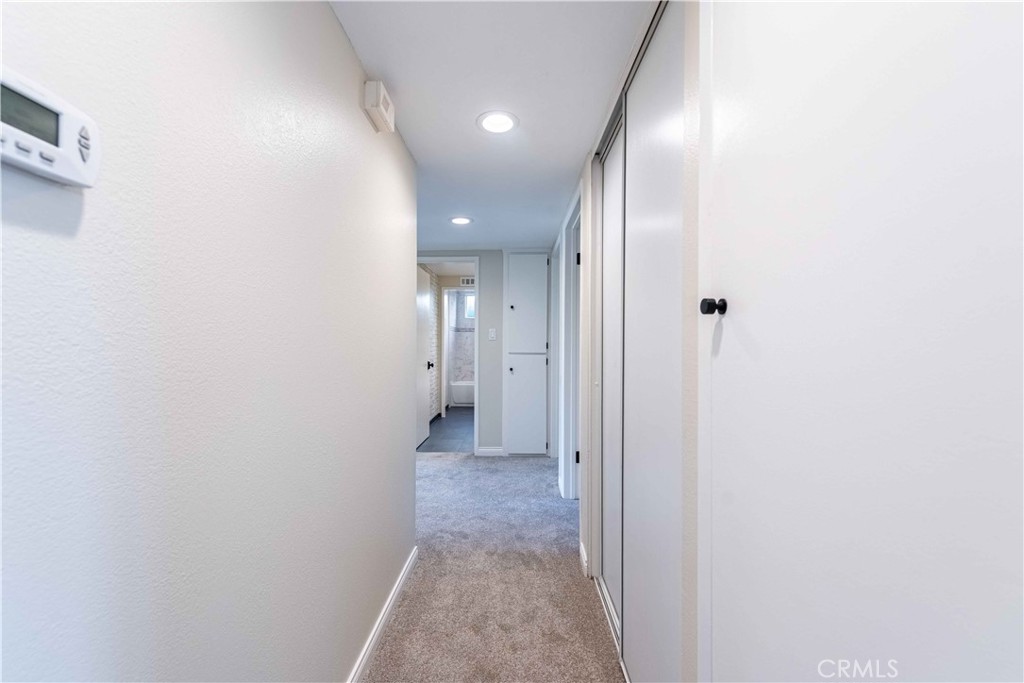 2232 Hawk Street Simi Valley, CA 93065 - Photo 16 of 39 a view of a hallway with wooden floor