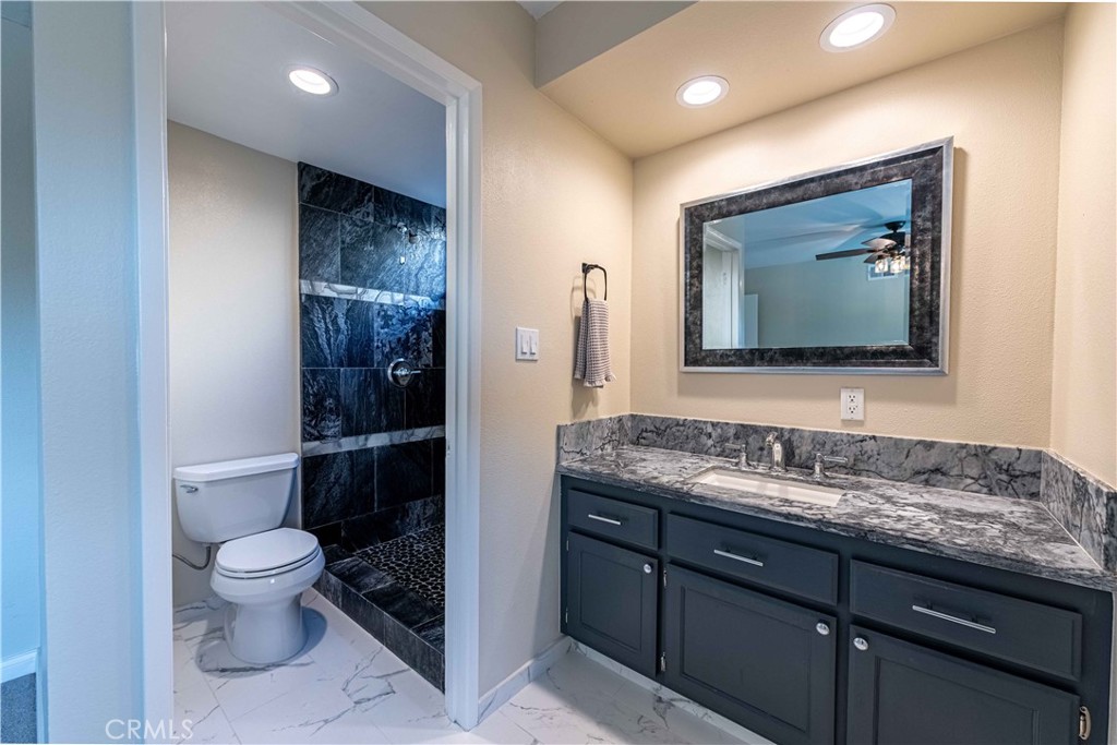 2232 Hawk Street Simi Valley, CA 93065 - Photo 19 of 39 a bathroom with a toilet sink and mirror