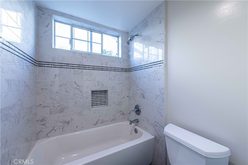 2232 Hawk Street Simi Valley, CA 93065 - Photo 29 of 39 a bathroom with a bathtub and a toilet