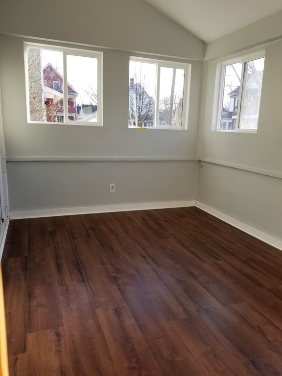 19 Merrick Avenue Springfield, MA 01109 - Photo 13 of 20 wooden floor in an empty room with a window