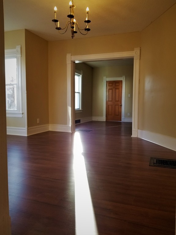 19 Merrick Avenue Springfield, MA 01109 - Photo 3 of 20 a view of a livingroom with wooden floor and a ceiling fan