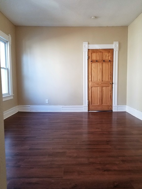 19 Merrick Avenue Springfield, MA 01109 - Photo 8 of 20 a view of an empty room with wooden floor and a window