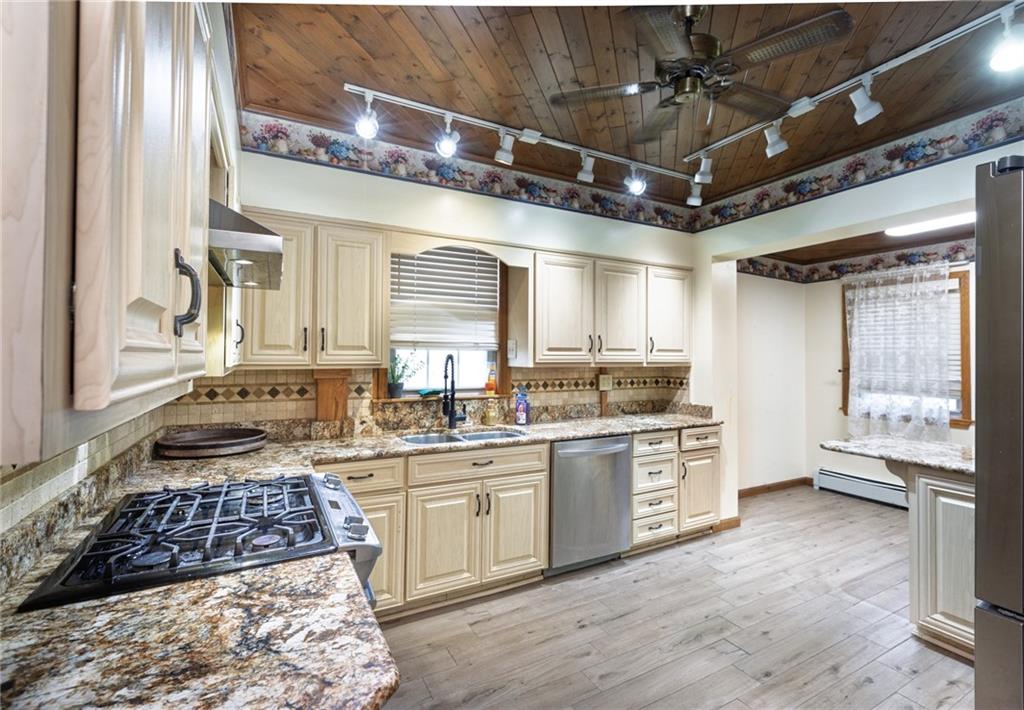 37 Redstone Street Republic, PA 15475 - Photo 6 of 19 a kitchen with stainless steel appliances granite countertop a sink stove and refrigerator