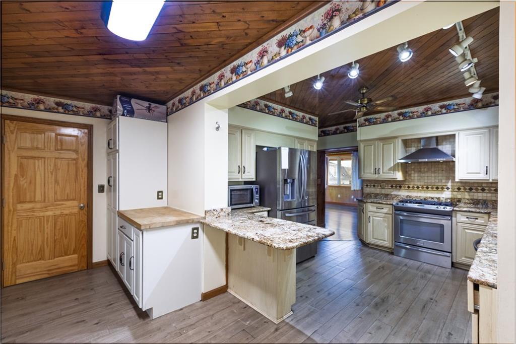 37 Redstone Street Republic, PA 15475 - Photo 7 of 19 a kitchen with stainless steel appliances granite countertop a sink stove and refrigerator