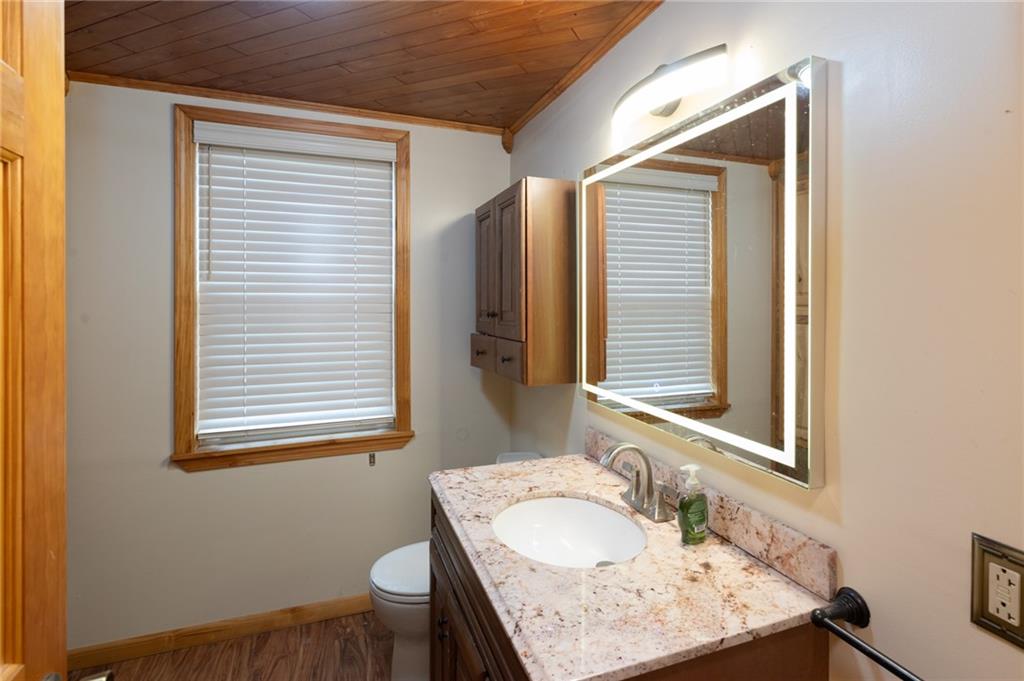 37 Redstone Street Republic, PA 15475 - Photo 8 of 19 a bathroom with a granite countertop sink and a mirror