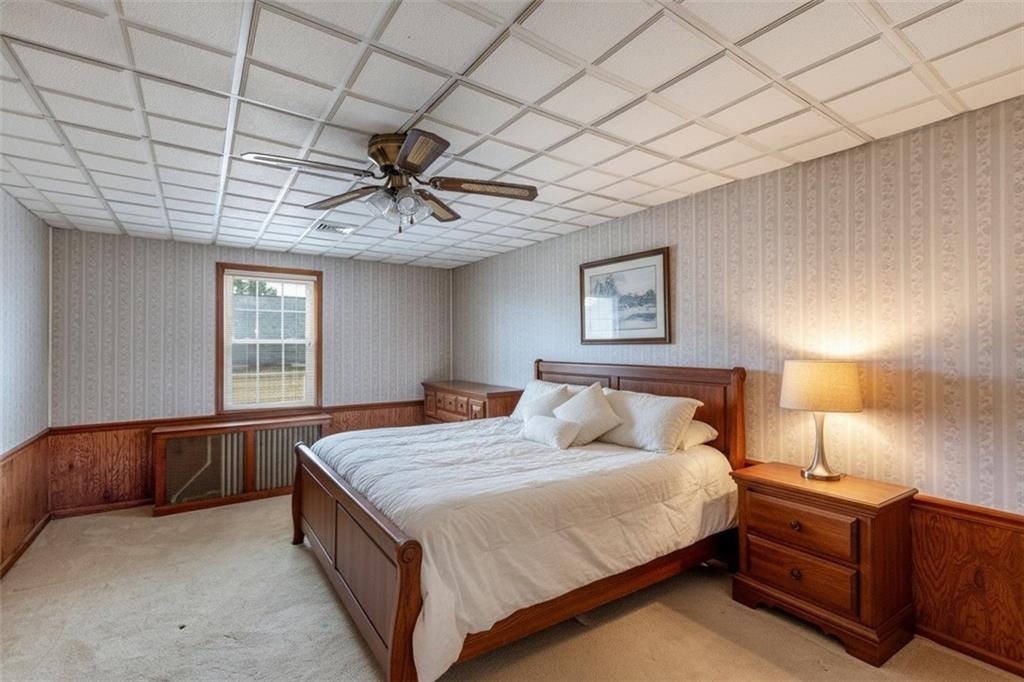 37 Redstone Street Republic, PA 15475 - Photo 9 of 19 a bedroom with a bed and a chandelier