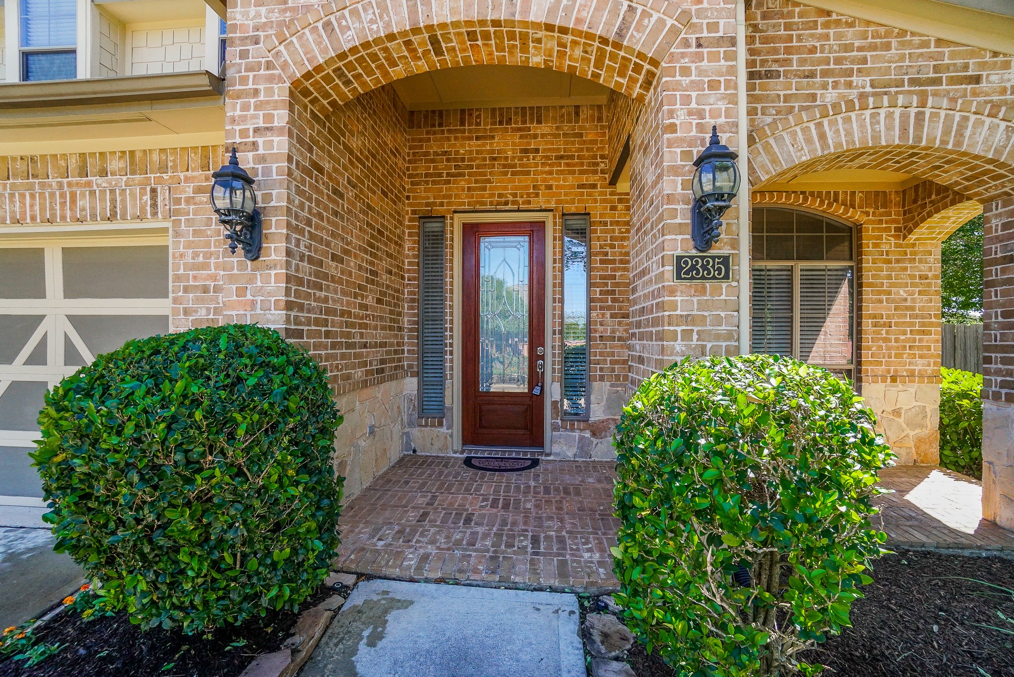 2335 Ralston Branch Way Sugar Land, TX 77479 - Photo 7 of 47 a front view of a house with garden