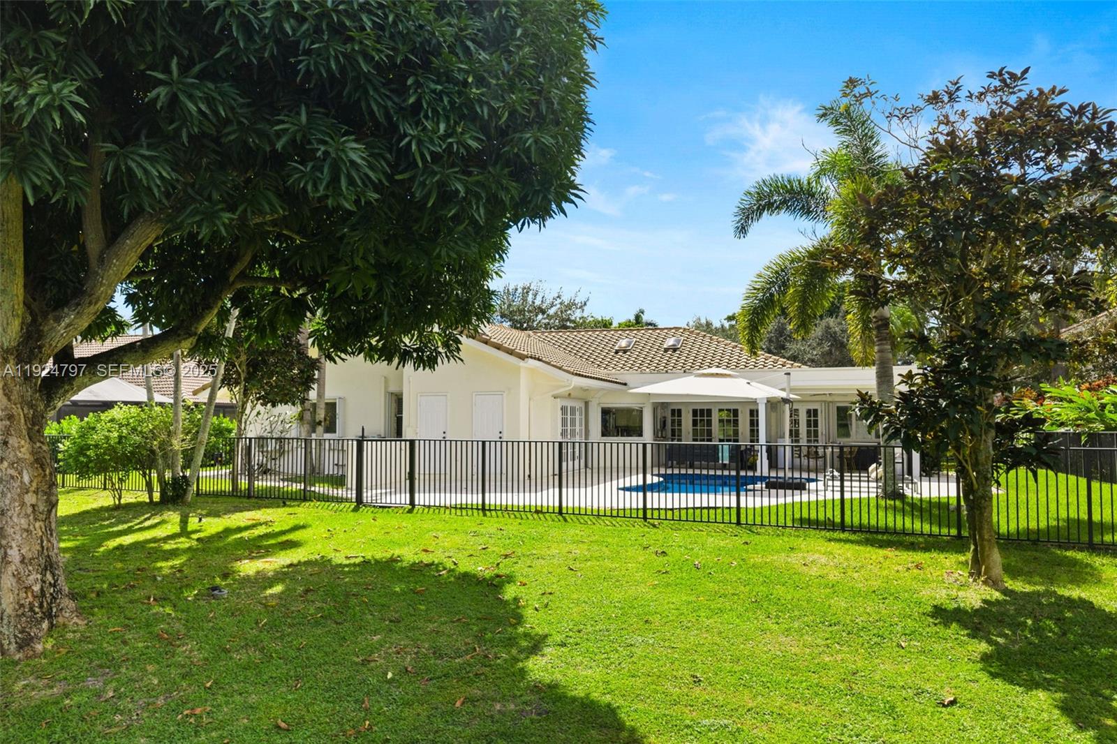 2729 Northwest 28th Street Boca Raton, FL 33434 - Photo 3 of 34 a view of a house with a backyard