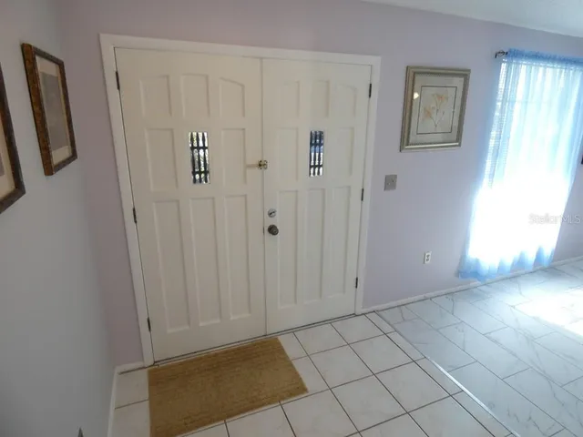 a view of a livingroom with furniture and a flat screen tv