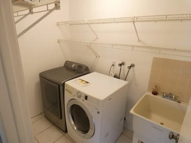 a bathroom with a shower and a sink