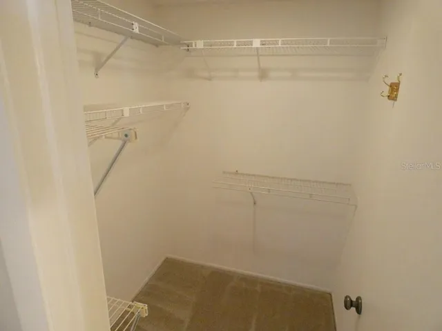 a kitchen with a sink cabinets and window