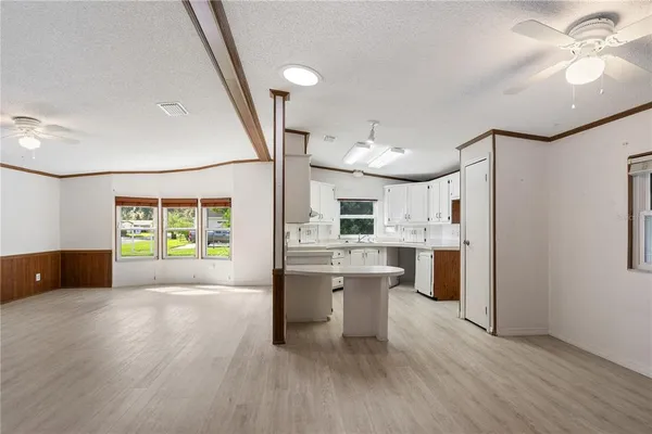 a kitchen with white cabinets and a sink