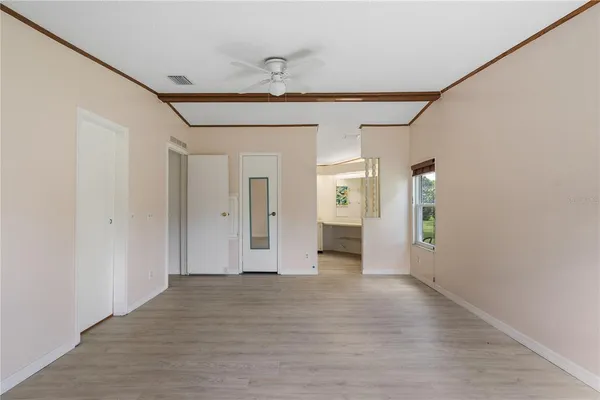 a view of an empty room with a window