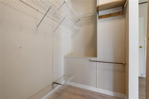 a view of an empty room with windows