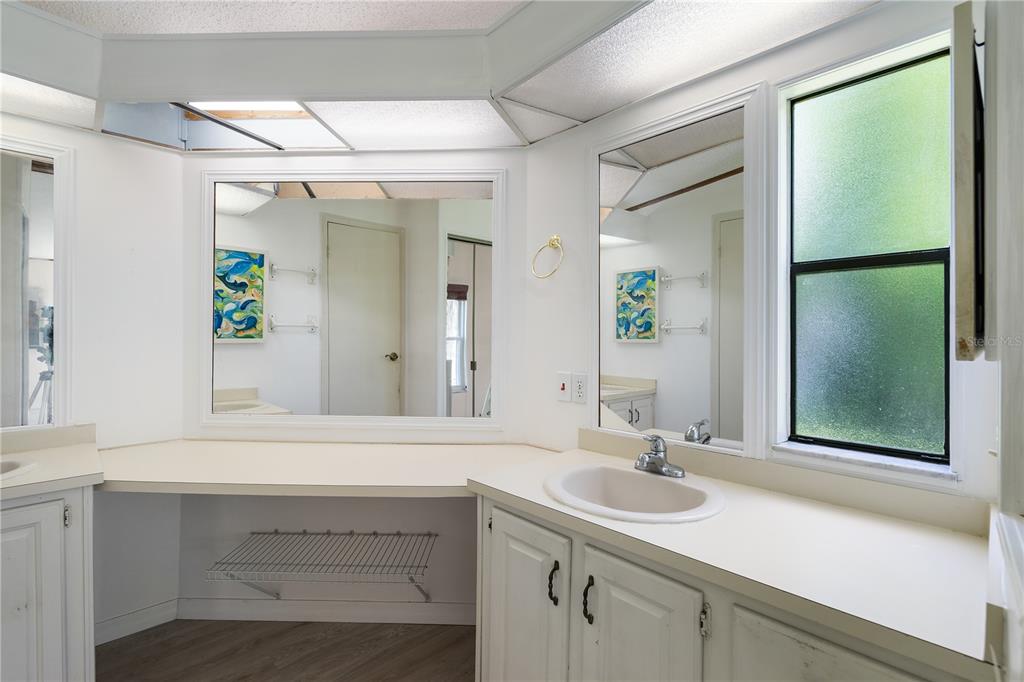701 Helmsman Lane Edgewater, FL 32141 - Photo 26 of 73 a bathroom with a sink and a mirror