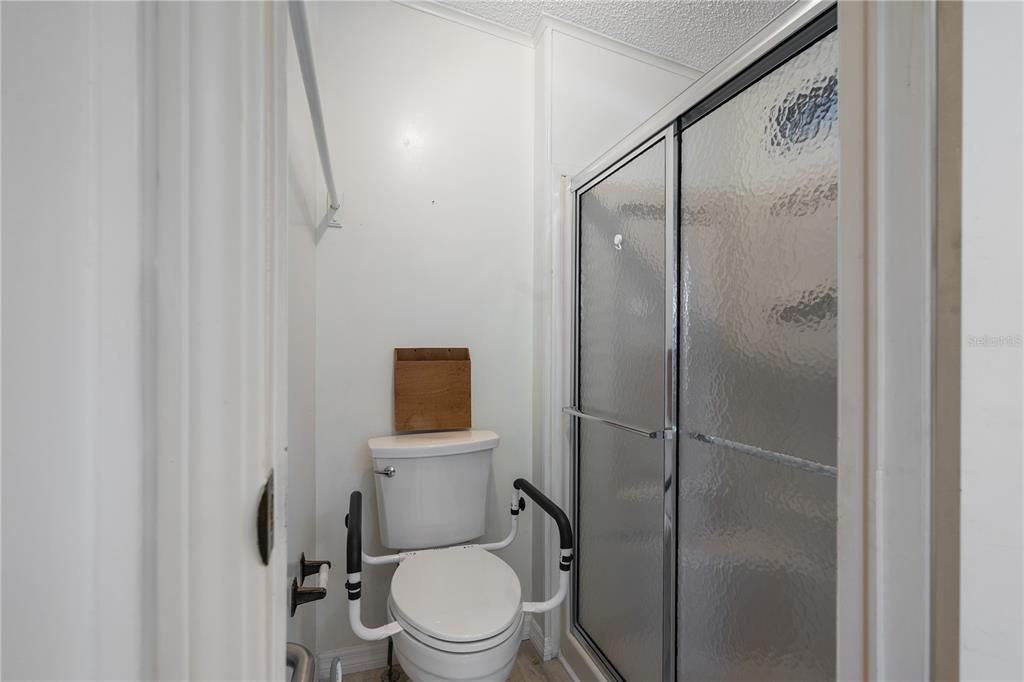 701 Helmsman Lane Edgewater, FL 32141 - Photo 27 of 73 a bathroom with a toilet and a shower